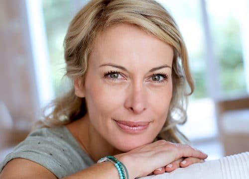 Middle-age woman with great skin after anti-aging treatments