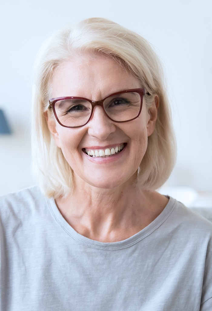 Smiling older woman wearing glasses